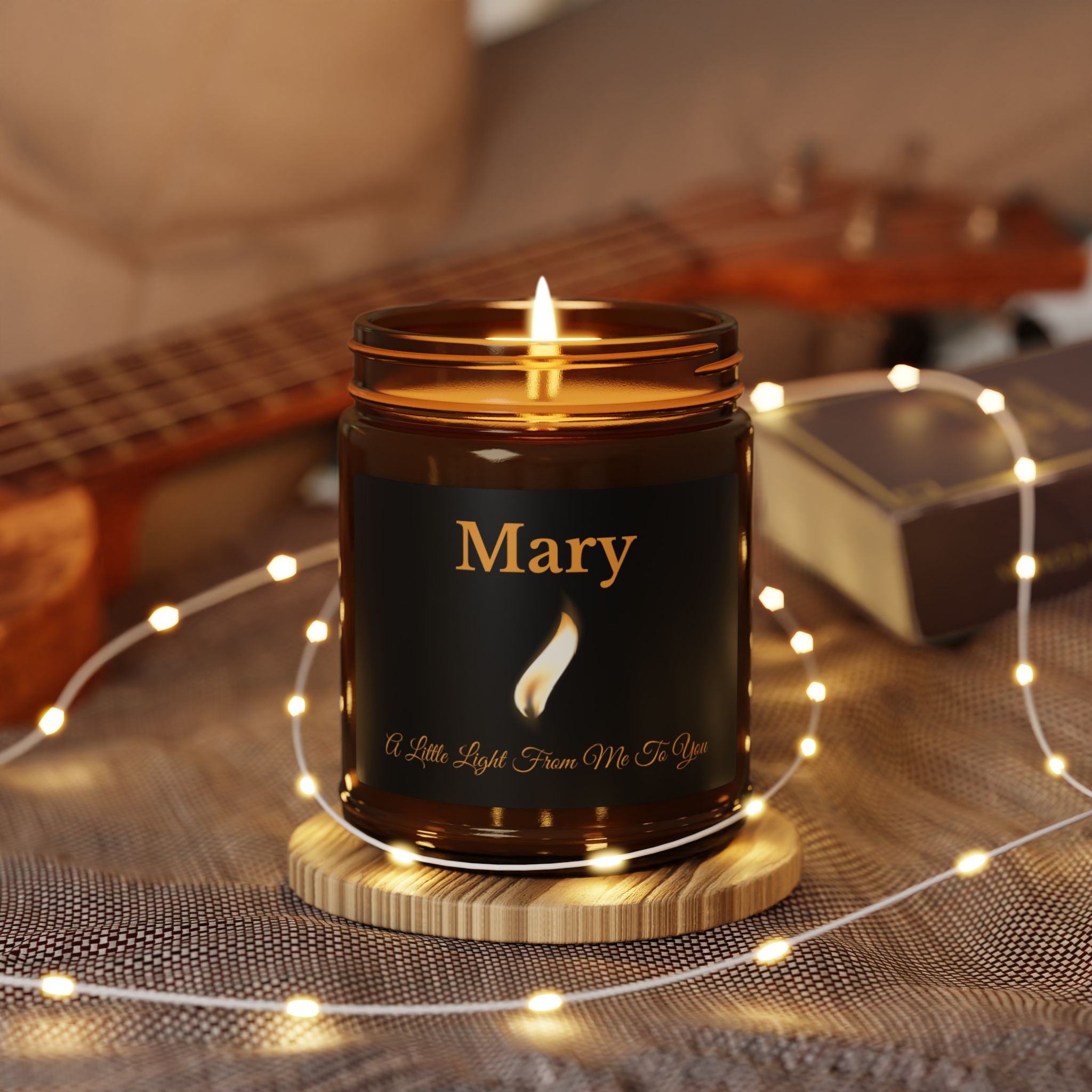 Close-up of the flame design and personalised name on the candle label