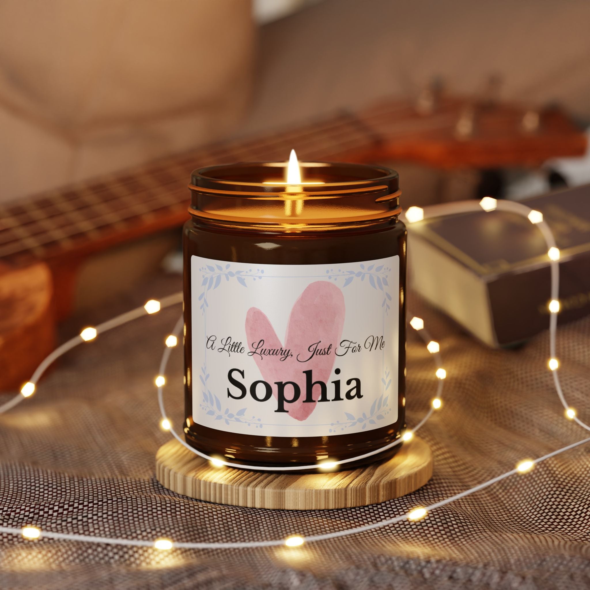 Close-up of personalised candle label with watercolour heart and botanical frame