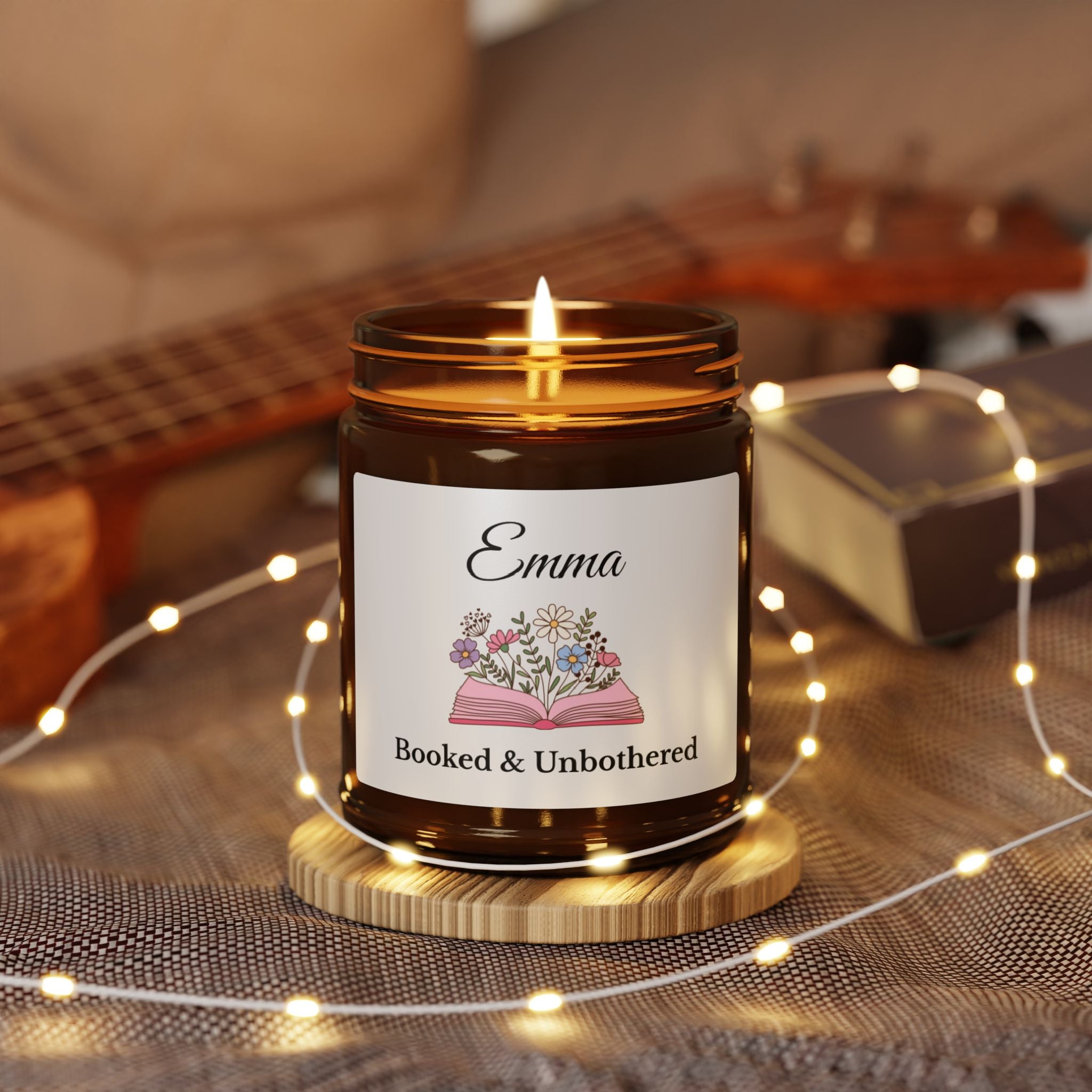 Close-up of the open book and floral illustration on the candle label