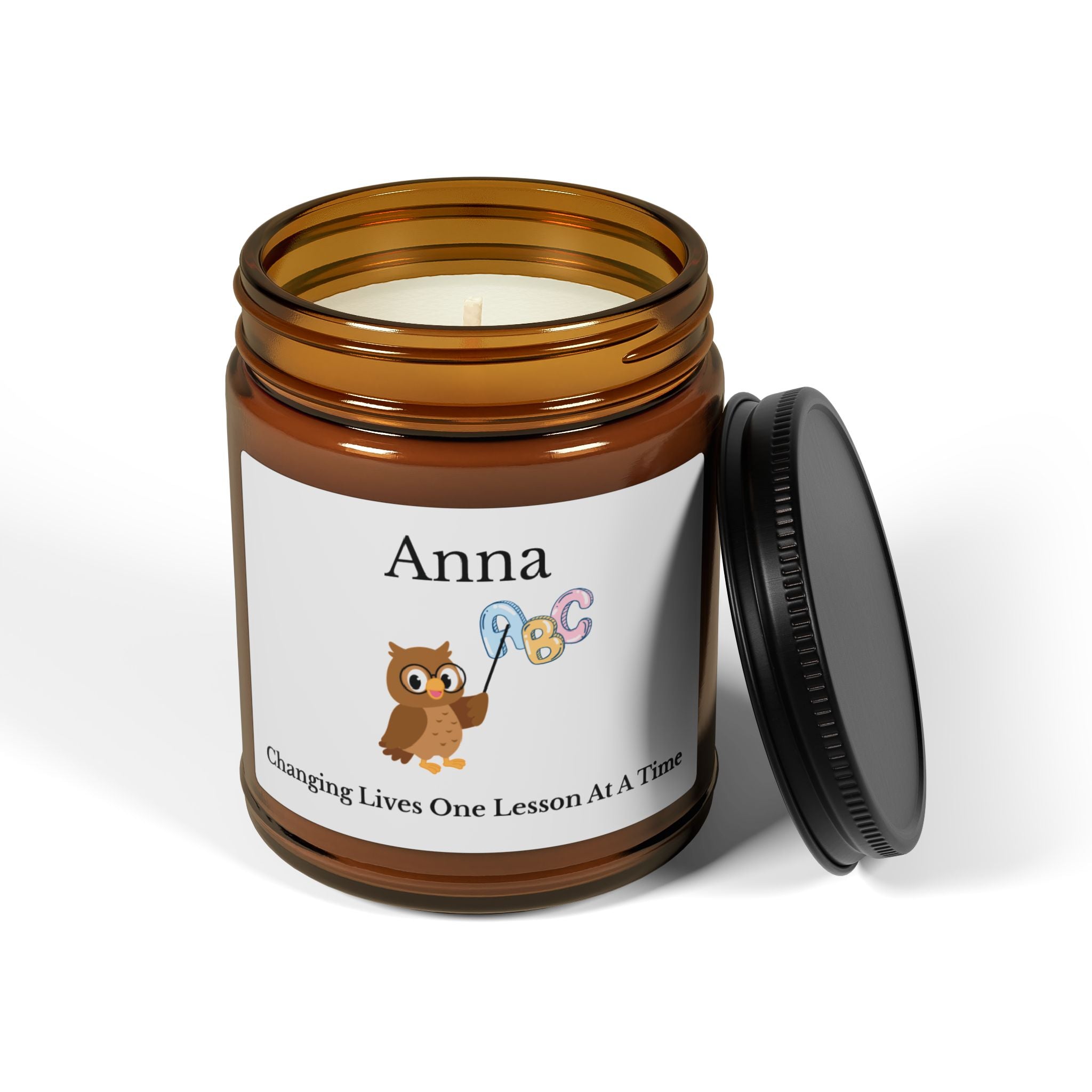 Personalised teacher candle shown in a cosy home setting