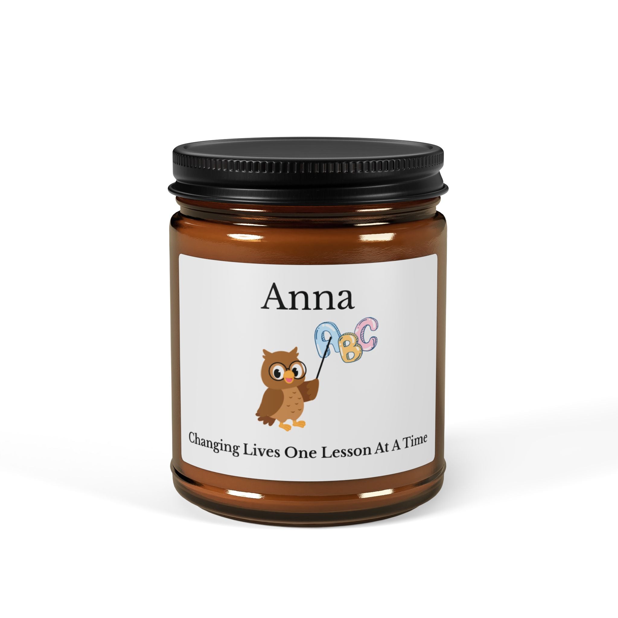 Personalised amber glass soy candle with name Anna and Changing Lives One Lesson At A Time owl design