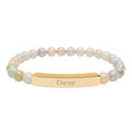 Daisy name bracelet displayed on a flat surface with beads visible