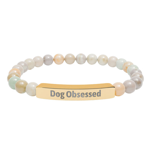 Dog Obsessed bracelet displayed on a flat surface with beads visible