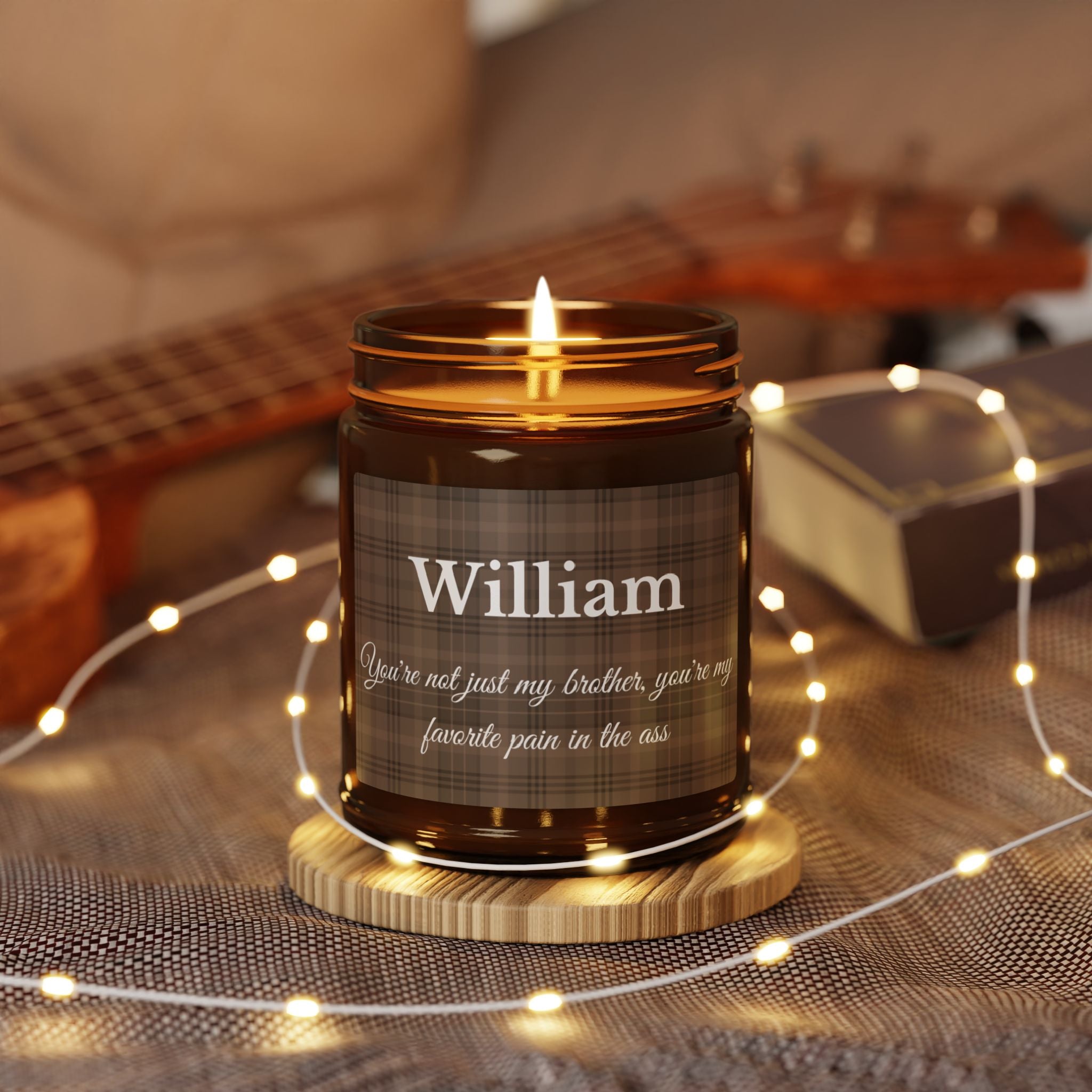 Close-up of tartan plaid candle label with personalised name in elegant white script