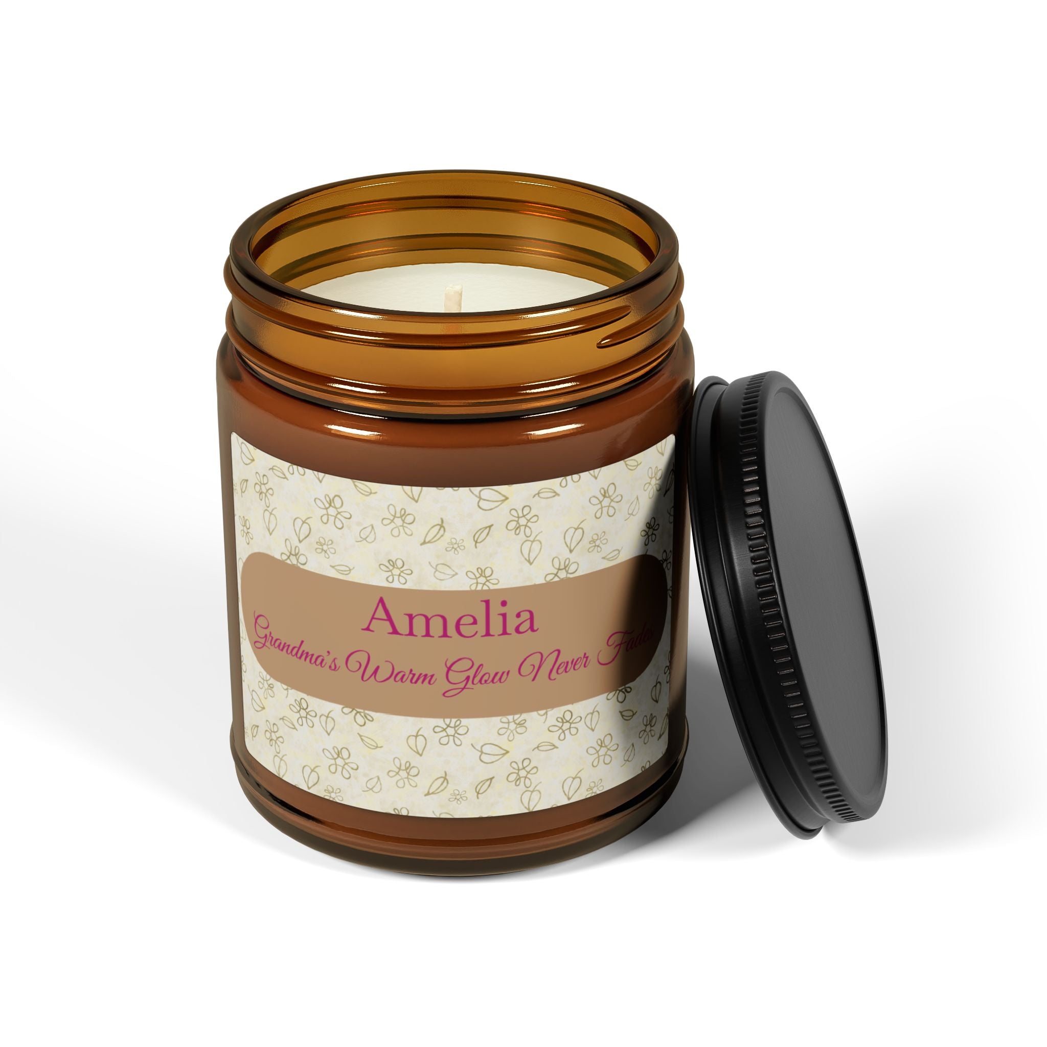 Close-up of cream floral candle label with magenta script name for grandma