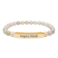 Inspire Minds bracelet displayed on a flat surface with beads visible