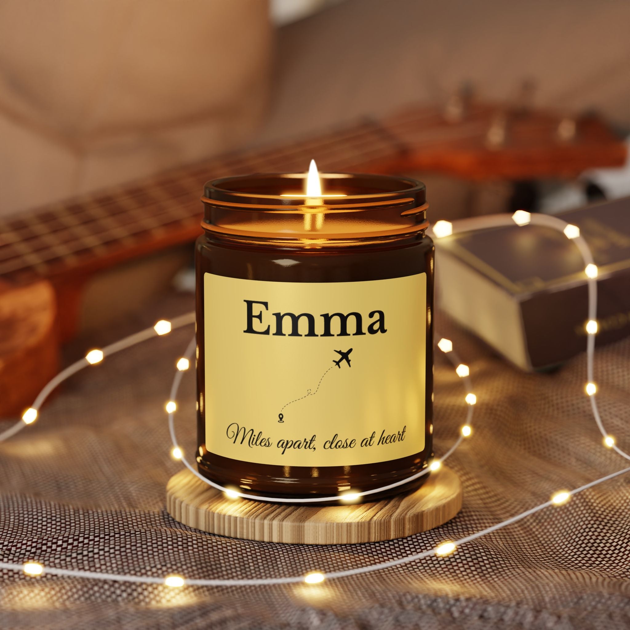 Close-up of the airplane and travel route artwork on the candle label