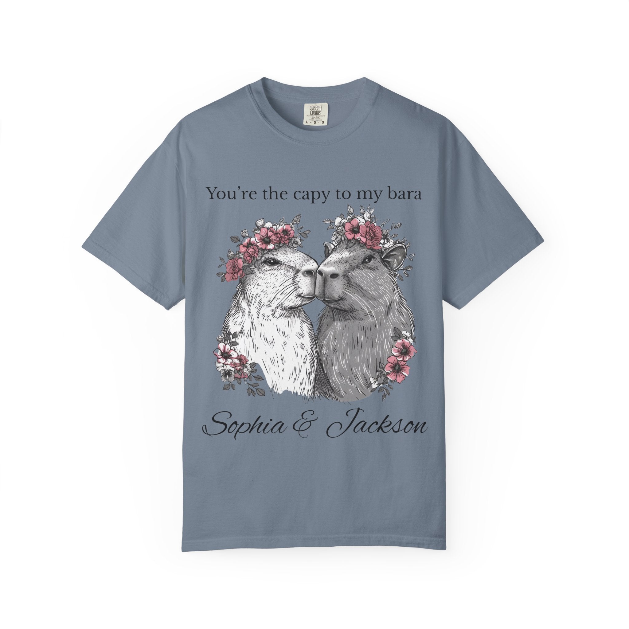 Close-up of flower-crowned capybara couple artwork on t-shirt