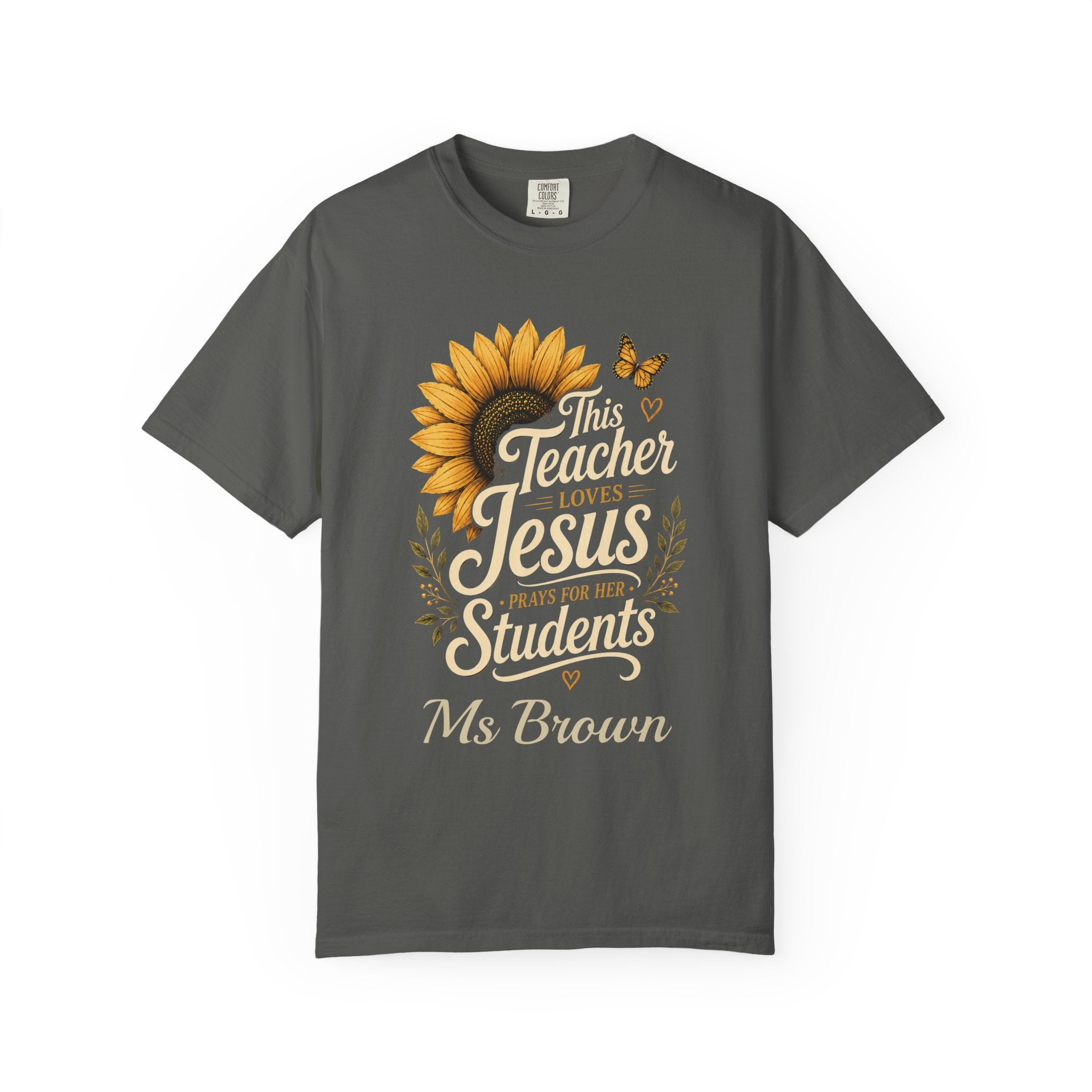 Faith-themed teacher t-shirt flat lay with custom name