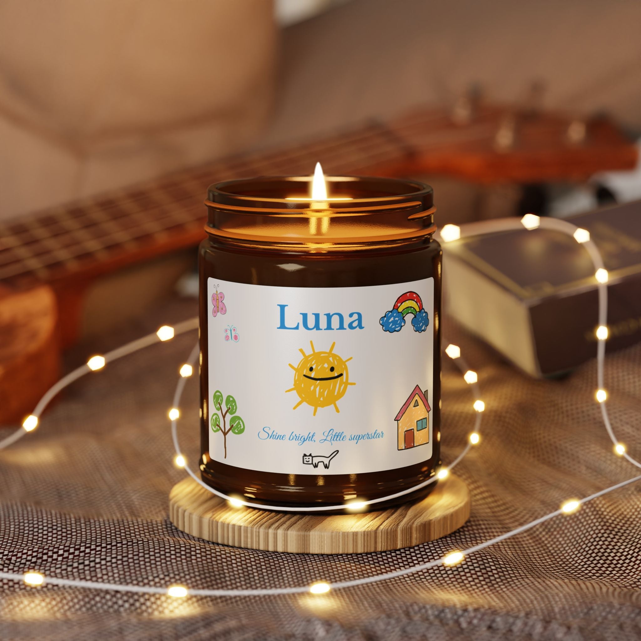 Close-up of custom name and rainbow butterfly artwork on candle label