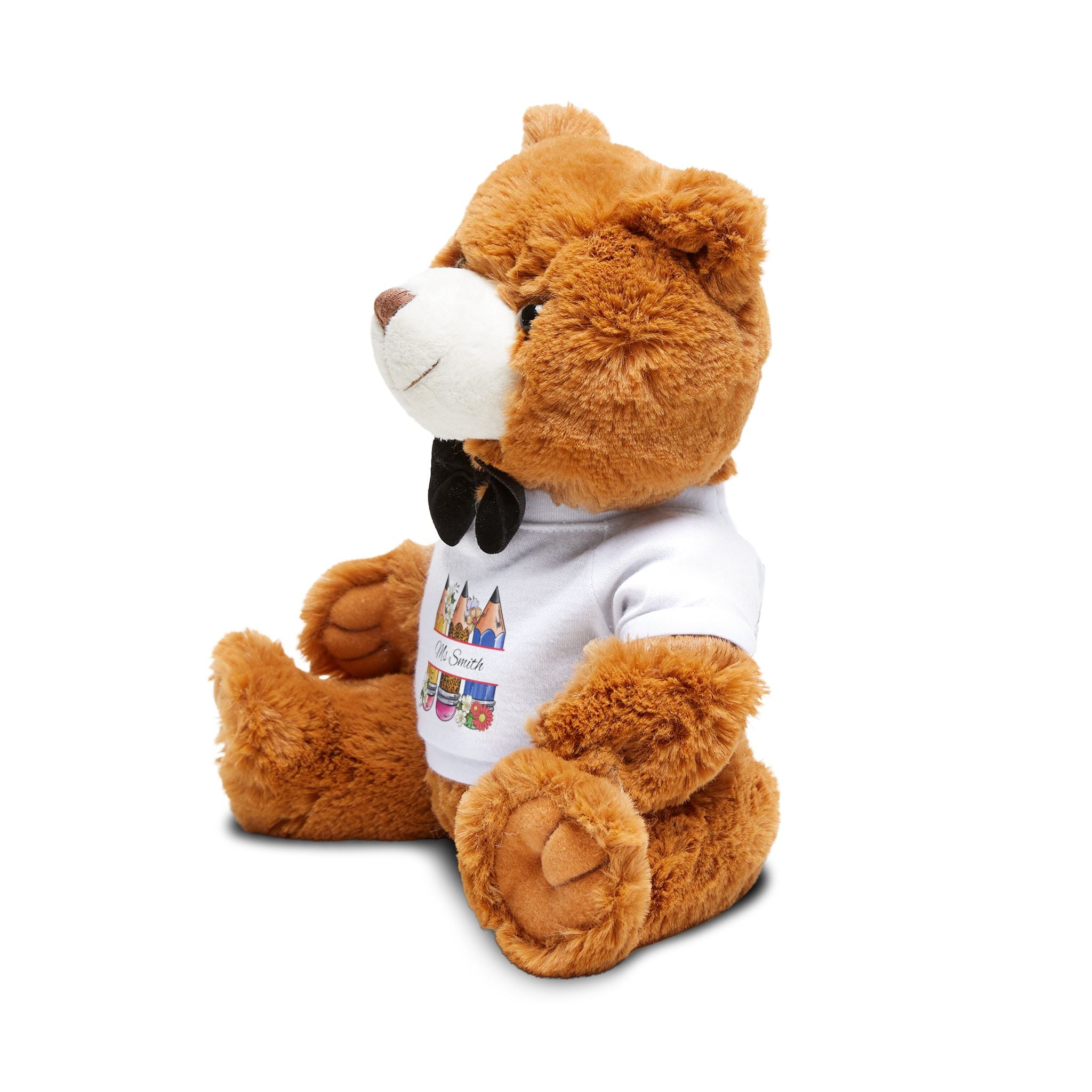 Close-up of the pencil and floral print on the teddy bear t-shirt