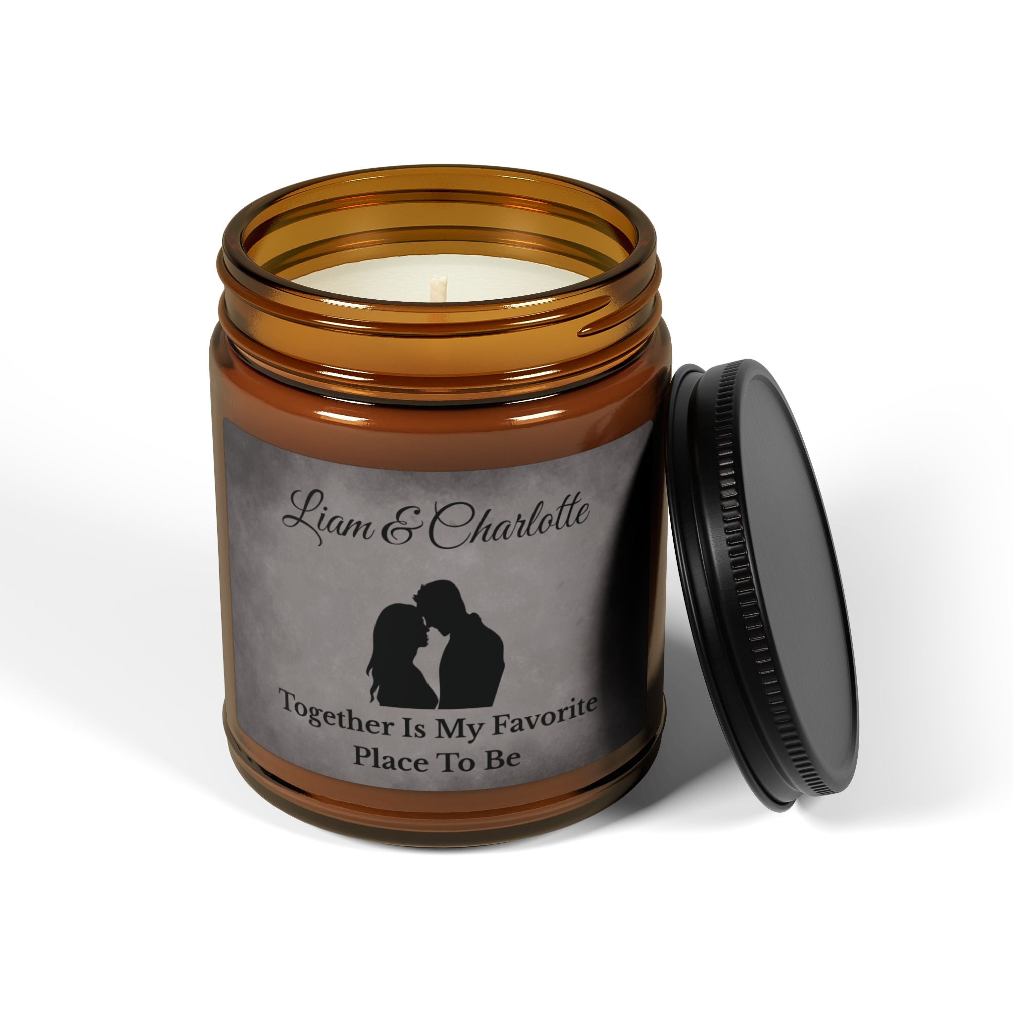 Close-up of grey marble candle label with couple silhouette and both names personalised