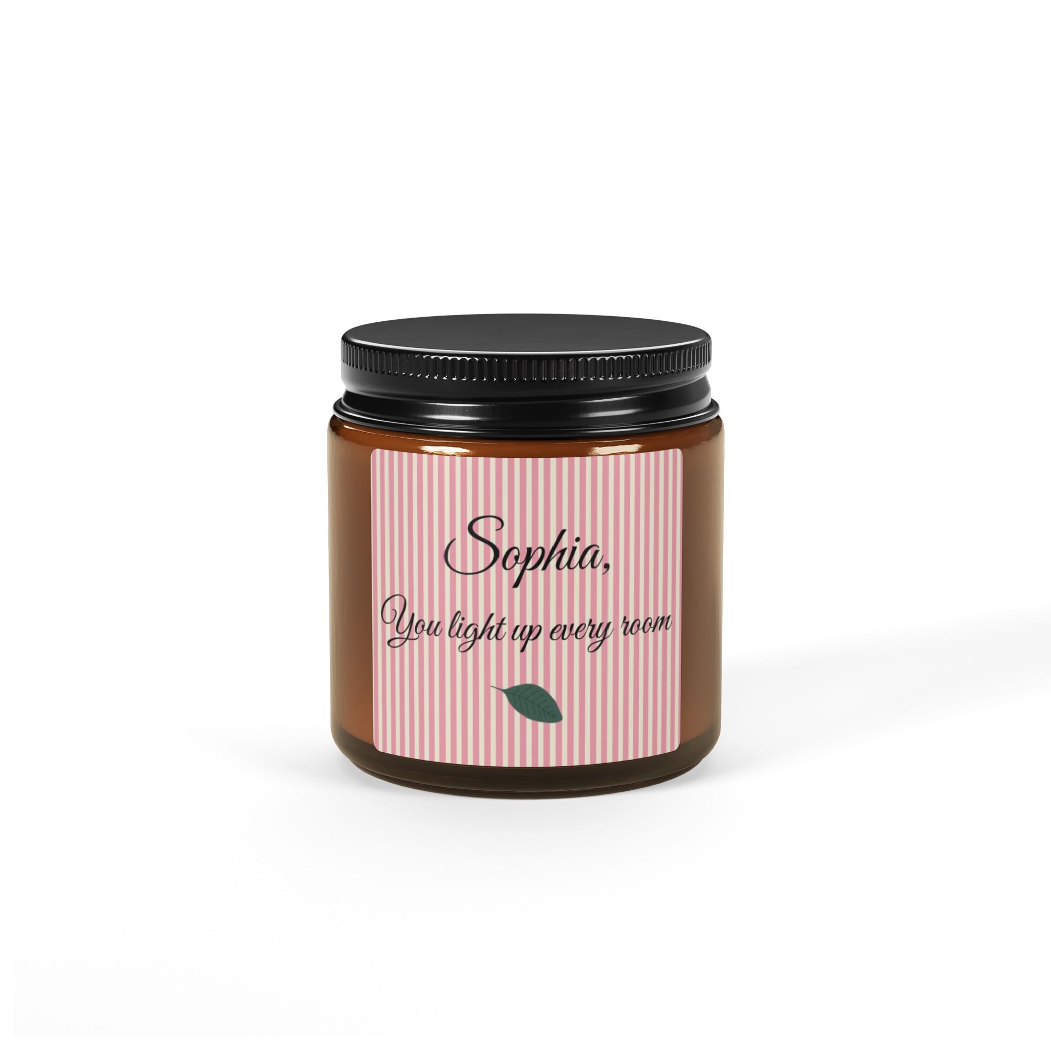 Close-up of personalised candle label with script name and botanical leaf motif