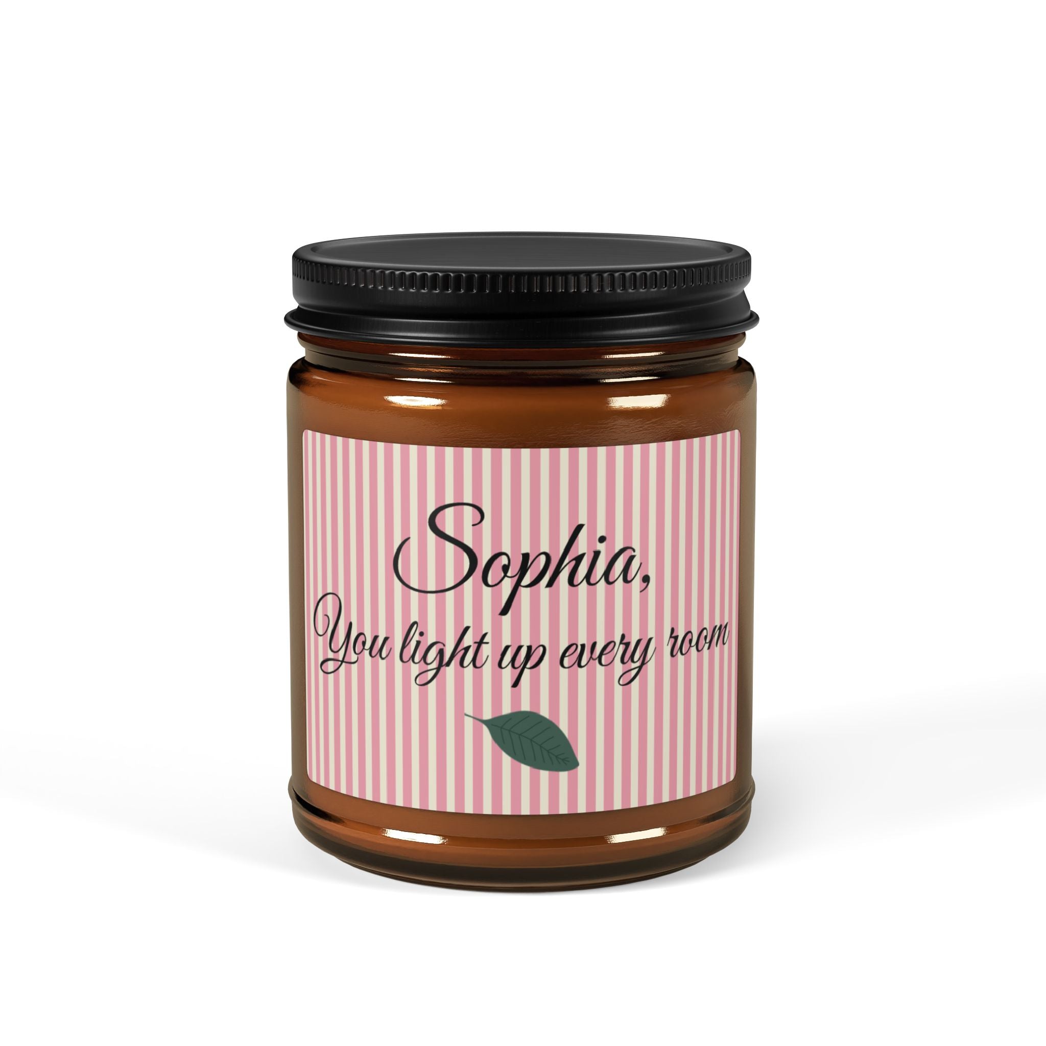 Personalised soy candle in amber jar with pink stripe label reading Sophia You light up every room