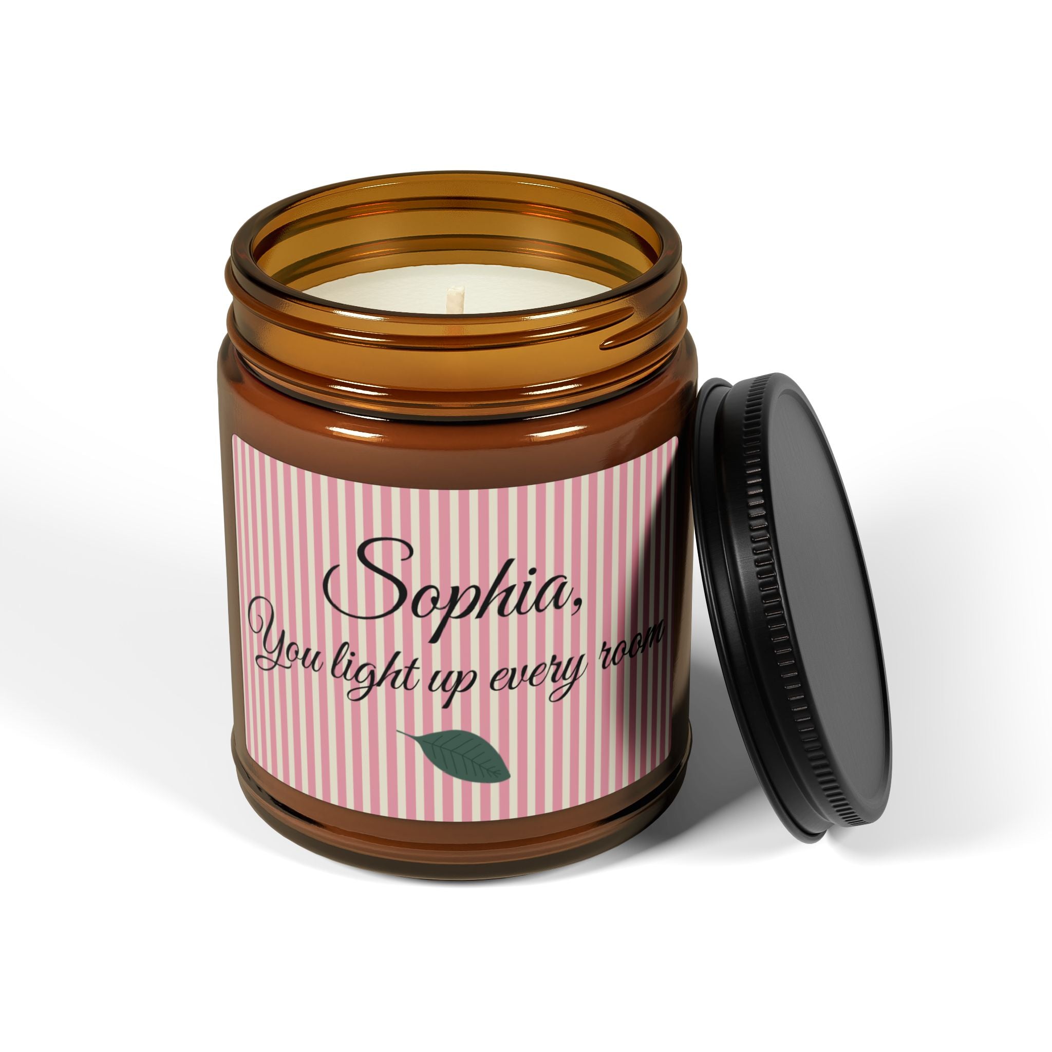 Personalised candle gift in amber glass jar with black lid on white background
